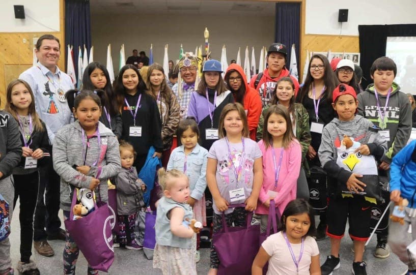 Children’s Commissioner Duke Peltier with a group of children at Koganaawsawin’s launch.